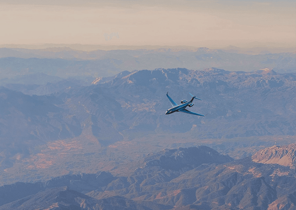 Private jet over a canyon